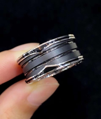 18K Gold Luxury Brand Jewelry Ring With Two 18 Kt White Gold Loops And A Black Ceramic Spiral