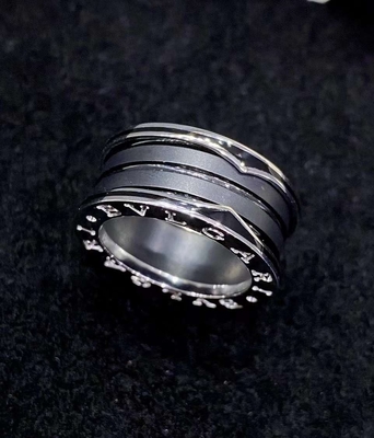 18K Gold Luxury Brand Jewelry Ring With Two 18 Kt White Gold Loops And A Black Ceramic Spiral