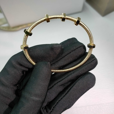 18K yellow gold (750/1000). Width: 3.5 mm Ecrou de Brand bracelet